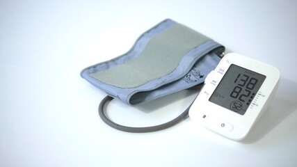 Electronic blood pressure meter and cuff on white background, Medical electronic tonometer check blood pressure, Health and Medical concept