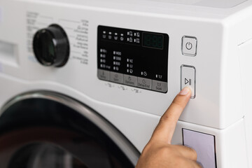 Finger press the switch to make the washing machine work. Home appliances