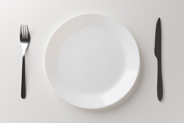 White empty plate set Placed with a knife and fork Ready for food menu