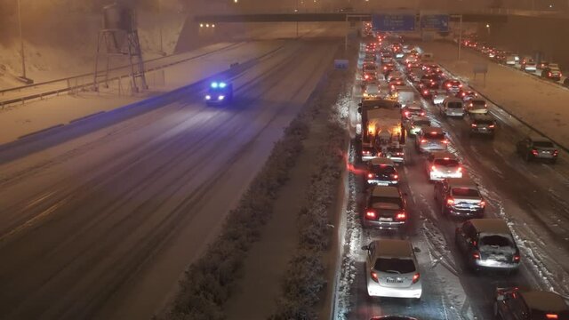 Traffic jam on A1 highway in Las Tablas, Madrid, Spain during a heavy blizzard