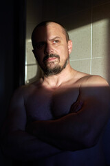 Early morning portrait lit by sun through window