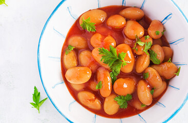 Stewed  beans in tomato sauce with spices.  Vegan food. Top view, flat lay, copy space