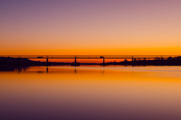 Bridge at sunset. Steel bridge over the Tagus river in Chamusca, Portugal