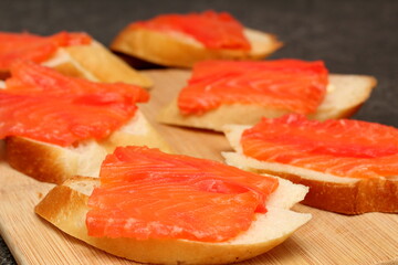 sandwich with red fish on a plate