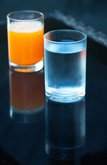 Drinking glasses and orange juice glasses for breakfast.