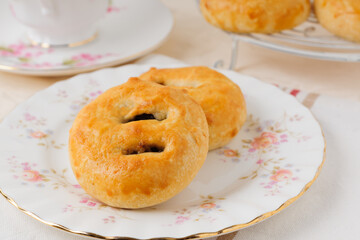 Eccles cakes a small round pastry filled with raisins originating from the town of Eccles in Lancashire England