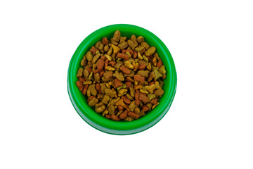 Dry food for cat or dog in a bowl. Pet food isolated on white background
