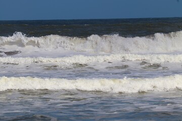 waves breaking on the beach
