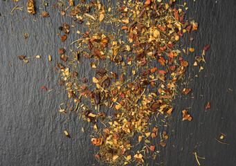 mixture of various dried spices on a black background