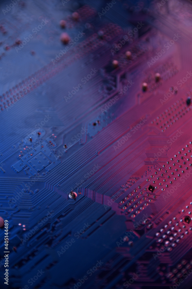 Poster close up of computer circuit board in blue and red lihgts