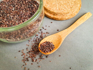 Himalayas black rock salt in wood spoon. Food concept