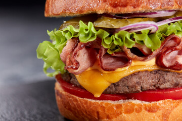 tasty burger with beef cutlet and vegetables