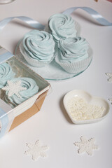 Homemade marshmallow in a gift box. Nearby marshmallows for packaging. Close-up shot.