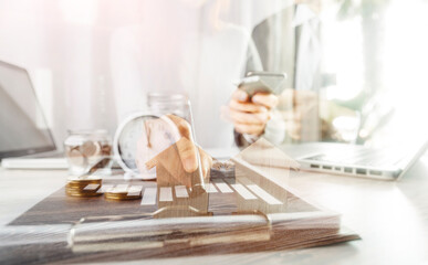 Businesswomen hands working with finances about cost and calculator and laptop with tablet, smartphone at office in morning light
