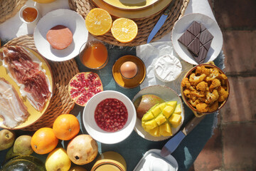 brunch with artichokes mussels croissants fruits brocoli feta salad ham bread and many other food and drink