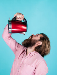 feel thirsty. mature charismatic male use electric kettle. guy with beard and moustache make tea....