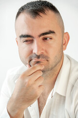 Fototapeta premium Portrait of a charismatic man with an expression of on his face. Emotions for posters or banners.