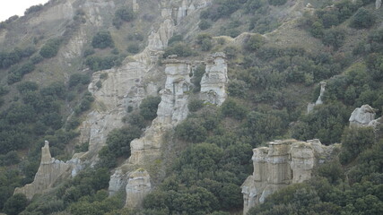Fototapeta na wymiar View of the Kuladokiya mountains. An unusual volcanic rock formation in the city of Kula, Turkey.