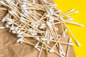 natural eco-friendly bamboo ear sticks on craft paper. Sustainable lifestyle.  Zero waste, plastic free concept.