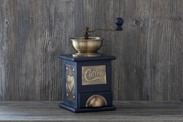 manual coffee grinder on wooden table