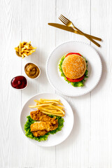 Overhead view of fast food - burger and french fries, flat lay