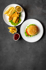Overhead view of fast food - burger and french fries, flat lay