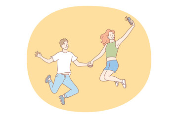 Selfie, smartphone, photograph vector illustration. Smiling young couple cartoon characters jumping together and making selfie on smartphone for sharing in social media