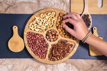 Mix of nuts top view. Walnuts, cashew, almond, pecan, hazelnut, peanuts Healthy various super food...