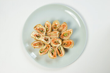 Top view of Holiday Russian starter dish blini with Philadelphia cream cheese, salmon and cucumber...
