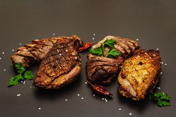 Fried duck breasts with fresh parsley, chili and black pepper, sea salt