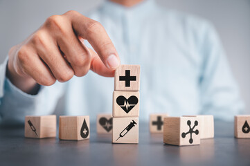 Hand drawn wooden block arrangement with medical, healthcare and insurance icons for your health. 