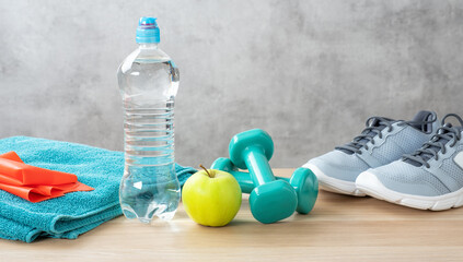 Fitness equipment on a wooden background