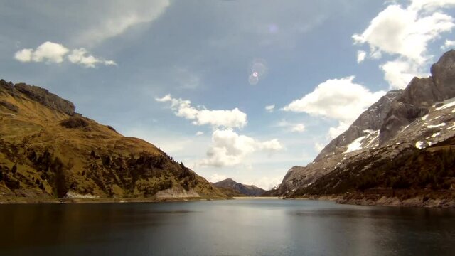 Lago di Fedaia, Dolomites mountains in Italy, time lapse video with clouds an sea beautiful