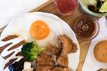 Classic USA breakfast. fried chicken, pancakes waffles, fried eggs.