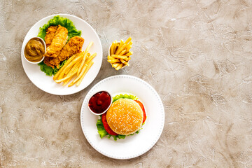 Overhead view of fast food - burger and french fries, flat lay