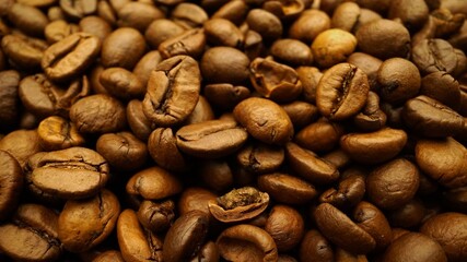 Coffee beans close-up in motion. Roasted Coffee beans close up. coffee beans.