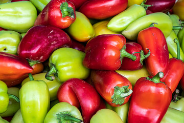 vegetables, tomatoes, cucumbers and sweet peppers on the counter close-up