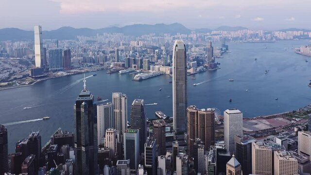 Aerial view of Hong Kong island financial center and Victoria harbour at sunset