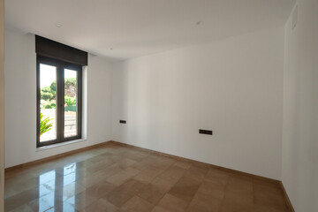 Empty room with marble floors.