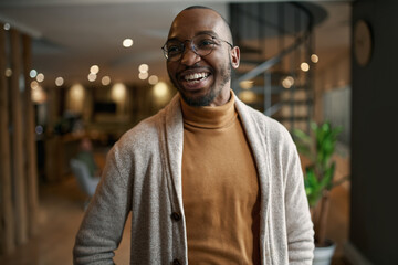 Portrait of creative trendy black african male designer laughing - Powered by Adobe