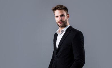 stylish guy with trendy hairstyle wear office suit, barber