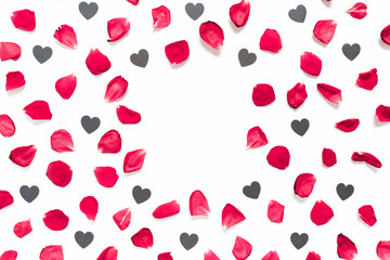 Rose petals and heart-shaped confetti are on a white background.  Floral layout for valentine's day, birthday, wedding invitation. Flat lay. Top view. Copy space.