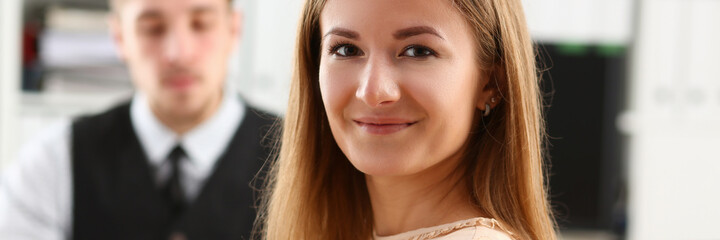 Obraz premium Charming longhaired female keeping smile on her face while taking part in the business meeting