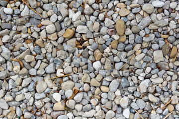 washed pebble stones on a seaside background