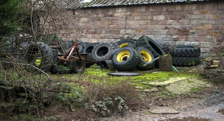 Old abandoned tractor tires on a farm