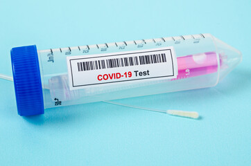 Fototapeta premium Tube containing nasopharyngeal swab for coronavirus or COVID-19 test.