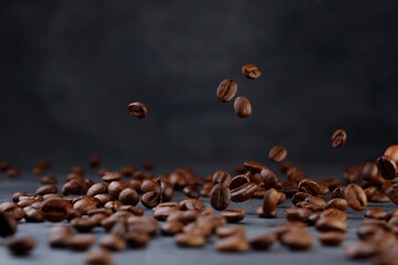 Flying coffee beans on a black background. 