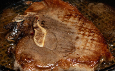 Fried meat steak on a plate.