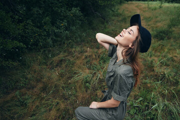 woman in the forest Looks to the sky closed eyes fresh air rest travel 