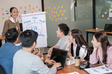 Group of Business putting forward suggestions to colleagues. Startup business team on meeting in modern bright office.They smiling and enjoying each others.